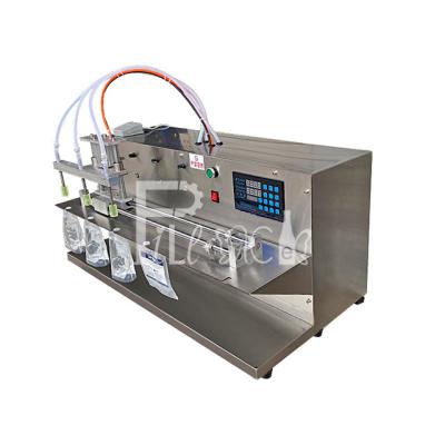 Chine Bureau semi-automatique machine de remplissage de piston de poche de bec de jus/lait/eau de 2/4 becs fi liquide électrique à vendre