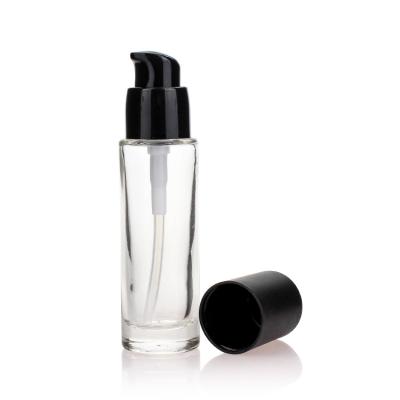 China Clear Matte Round Pump Bottle 30ml Glass Bottle With Cap For Liquid Foundation for sale