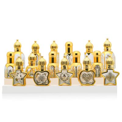 China Beauty Packaging Mini Glass Roll On Bottles 12ml For Perfume Packaging Golden Glittering for sale