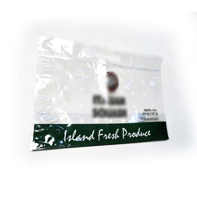 Retail display of transparent perforated bags for produce