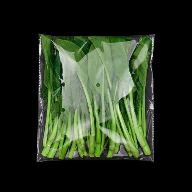 Produce bag with fresh vegetables demonstrating retail display quality