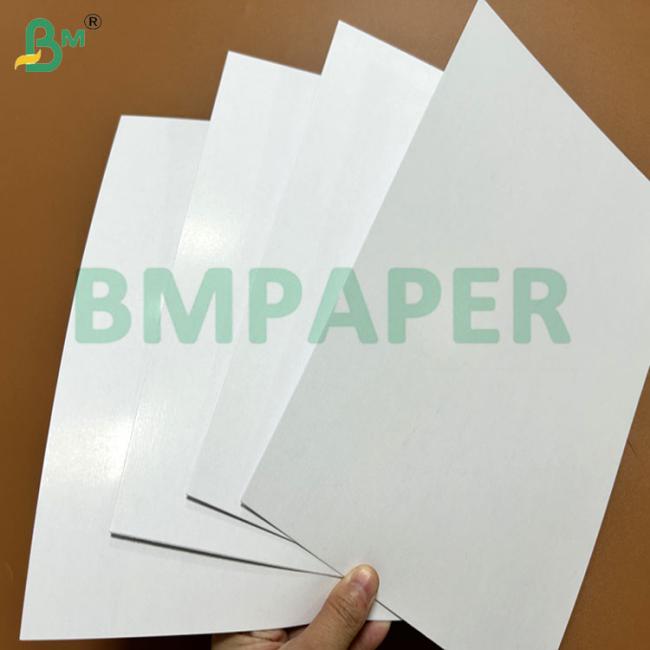 Stack of black core paper sheets showing thickness and edge quality