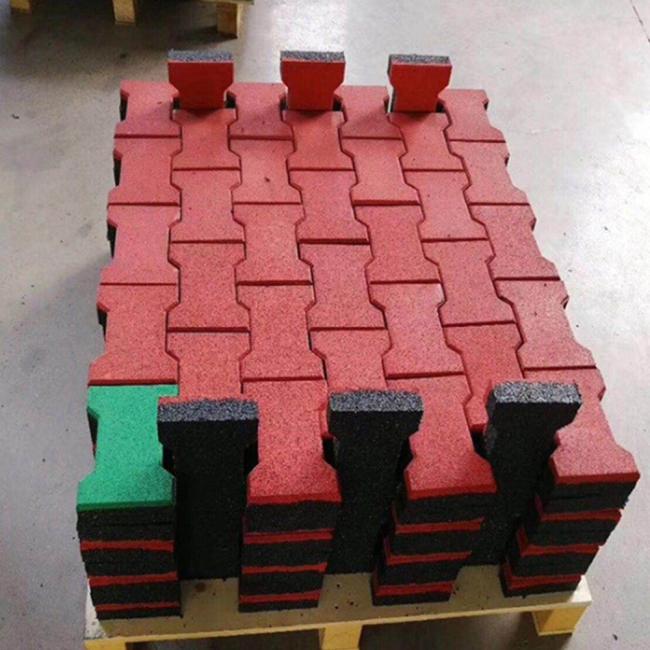 Dog bone shaped rubber pavers in outdoor setting