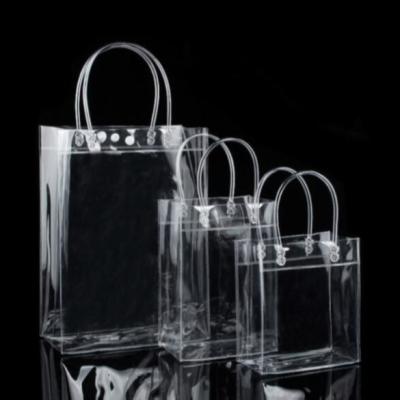 China 13x7x15cm Garment Plastic Packaging Bags PVC Transparent Tote Bag With Handle Button for sale