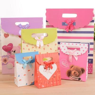China Customized pattern Cardboard Gift Bags 24x10x32cm With Handle Bow Knot for sale