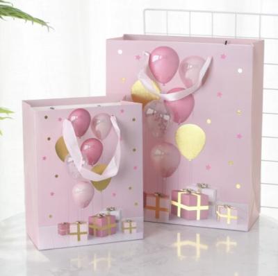 China Gold Stamping Party Balloon Gift Bags With Handle Pink Printed Logo for sale