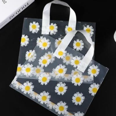 China Waterproof Garment Plastic Packaging Bags With Little Daisy Pattern Printing for sale