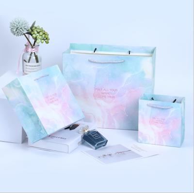 China Marble Pattern Business Gift Paper Bag Portable Shopping Clothing Packaging Bag for sale