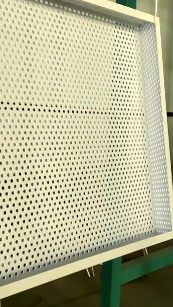 Custom fabricated perforated wire mesh panel with reinforced edges