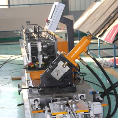 China Ceiling T Grid Light Keel Roll Forming Machine With 1.2 Inch Chain Drive for sale