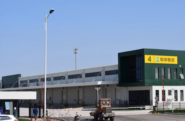 Steel structure warehouse under construction showing H-section steel columns and beams