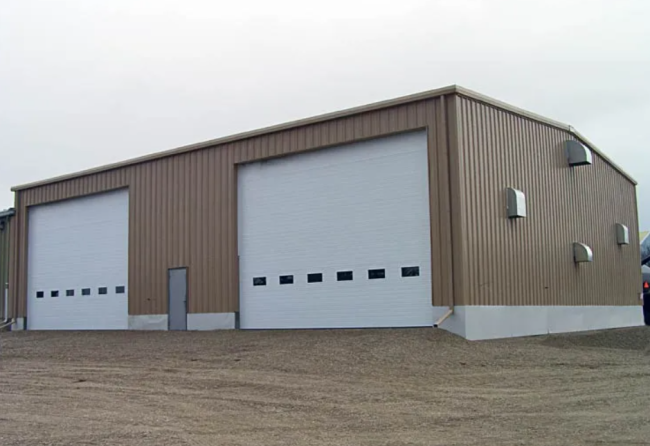 Steel structure warehouse with sandwich panel walls and roof, showing clean design