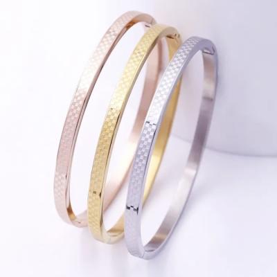 China Bracelete Oval Branco de Ouro Bracelete de Aço Inoxidável Laser Gravado Moda à venda