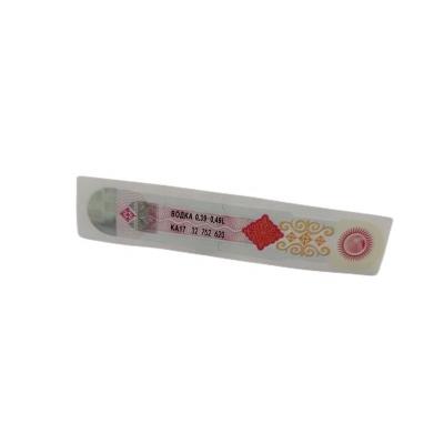 China Etiquetas adhesivas blancas de falsificación antis de encargo ROHS de la etiqueta del vino HX-188 en venta