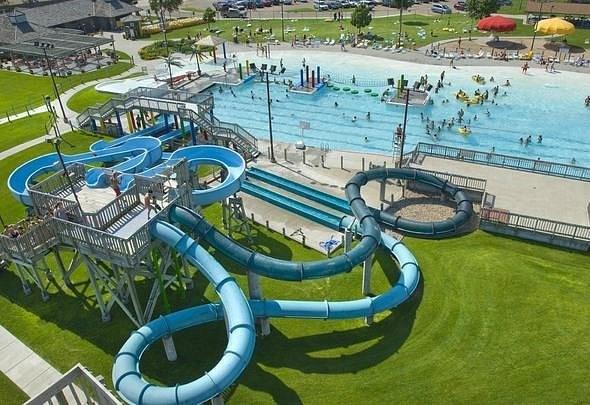 Colorful fiberglass water slide installation in aqua park