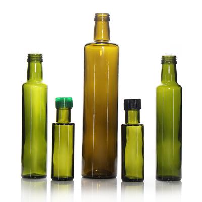 China Botella redonda de aceite de vidrio Marasca de 100 ml con tapa a prueba de alteraciones en venta