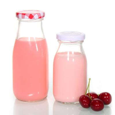 China Custom Printed Recycled Glass Milk Bottles 1l Clear Transparent for sale