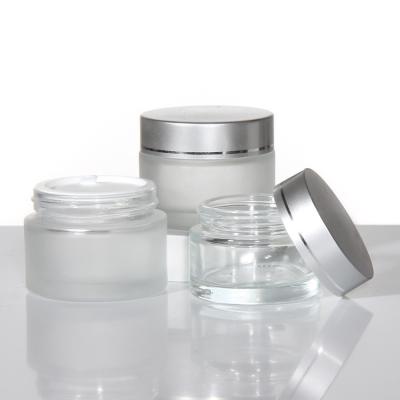 China Jarrones de crema de vidrio de 50 ml y 100 ml para cosméticos de cuidado de la piel en venta