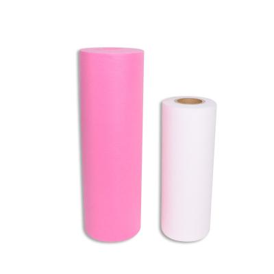 China Soft SS Non Woven Bed Sheet Roll In 30gram Non Woven White Pink For Beauty Salon for sale