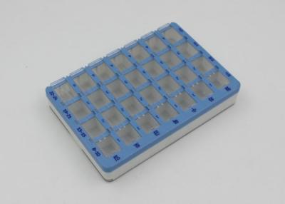 Chine 28 compartiments ont coloré la boîte en plastique de pilule avec le couvercle de glissière/quotidiennement l'organisateur de pilule à vendre