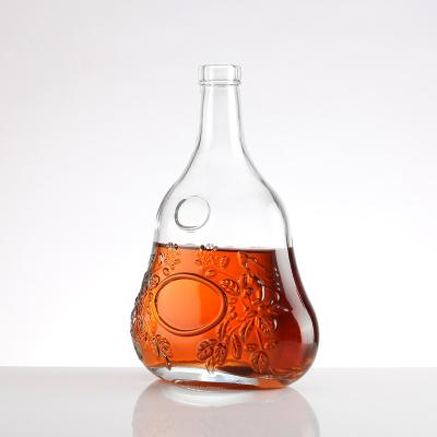 China Style Super Flint Glass Bottle Unique Shape Embossed Body Vodka Brandy Liquor Bottle for sale