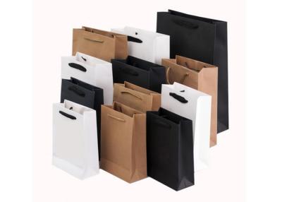 China Printed Retail Flat Handle PMS Kraft Paper Shopping Bags for sale