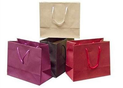 China Custom Printed Luxury Paper Shopping Bags Large Paper Shopping Bags With Handles for sale