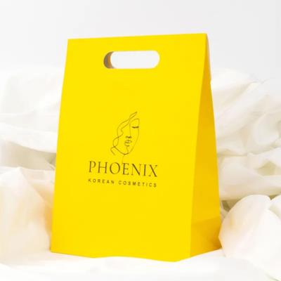 China Clothing Packaging Die Cut Handle Shopping Kraft Paper Bag Customized Yellow Gift Bags for sale