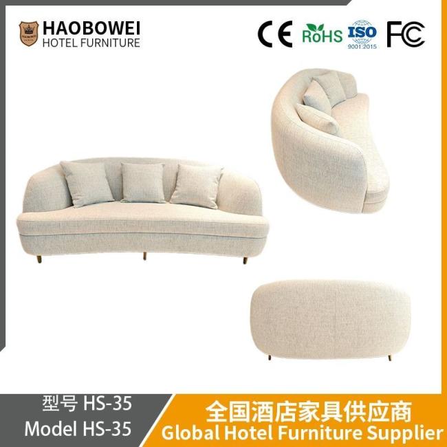Modern Italian Minimalist Sofa for Small-Sized Living Room and Reception Area. White Cream Style Curved Sofa Made of Cat Scratch-Resistant Leather Cloth.