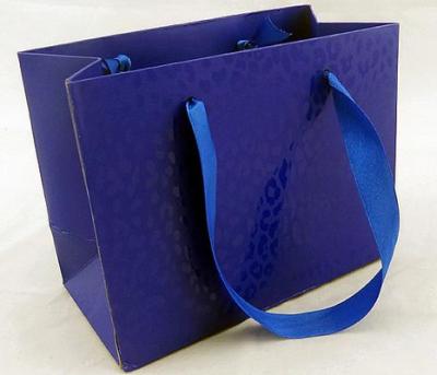 China Glossy Lamination Ribbion Handle Luxury Paper Shopping Bags for Clothing Boutiques for sale