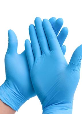 China Pulverice el elástico azul disponible libre de la categoría alimenticia de los guantes del nitrilo en venta