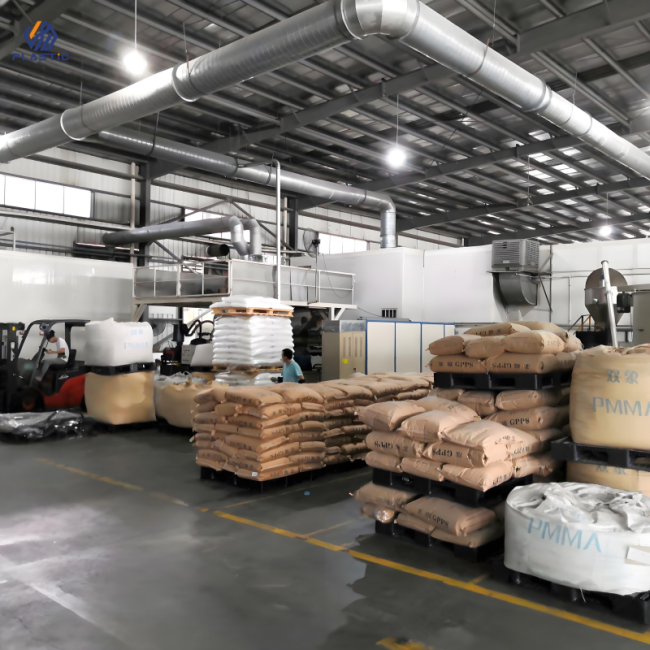 Factory interior with acrylic sheet production equipment