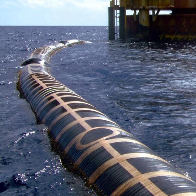 Floating dredge hose in operation during dredging project