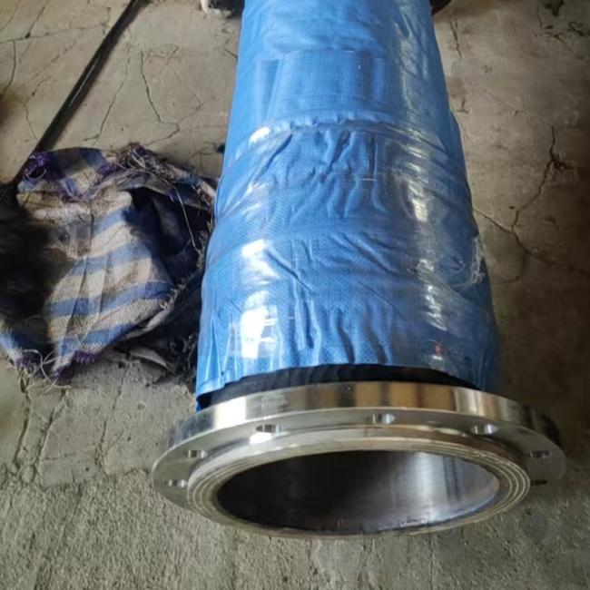 Close-up view of discharge hose connection points and flange options