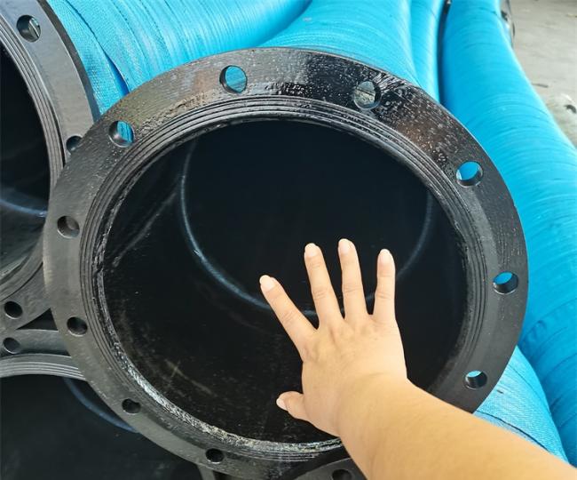 Mining hose in industrial setting with fittings