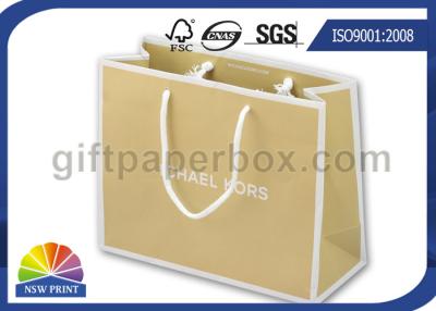 China Las bolsas de papel de Brown Kraft venden al por mayor los bolsos de compras del papel de Brown para la ropa o los zapatos en venta