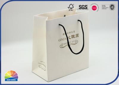 中国 Custom Logo Paper Shopping Bags Luxury Boutique Gift Paper Bag With Handle 販売のため