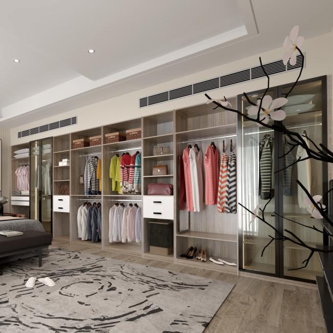 Adjustable walk-in closet with classic white finish and elegant hardware