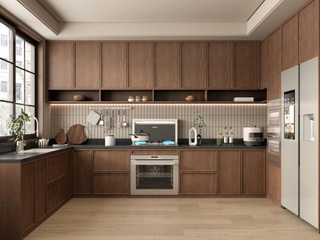 Close-up view of kitchen cabinet doors showing brass hardware and glass panel details