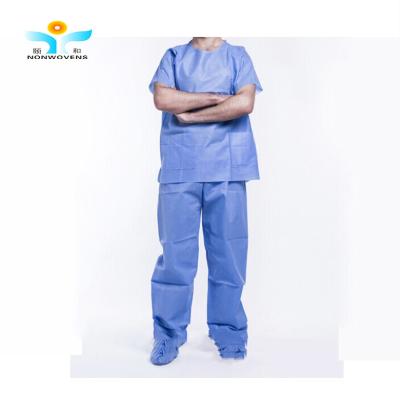 China YIHE escuro - o exame paciente descartável azul veste a prova da poeira com bolsos à venda