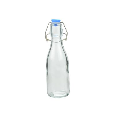 China Clear Glass Milk Bottles 270ML Glass Kombucha Bottles With Stoppers for sale