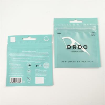 Chine Bas emballage avant clair de sac de tirette de papier d'aluminium de sacs de conditionnement en plastique de trou de coup de fil dentaire de MOQ à vendre