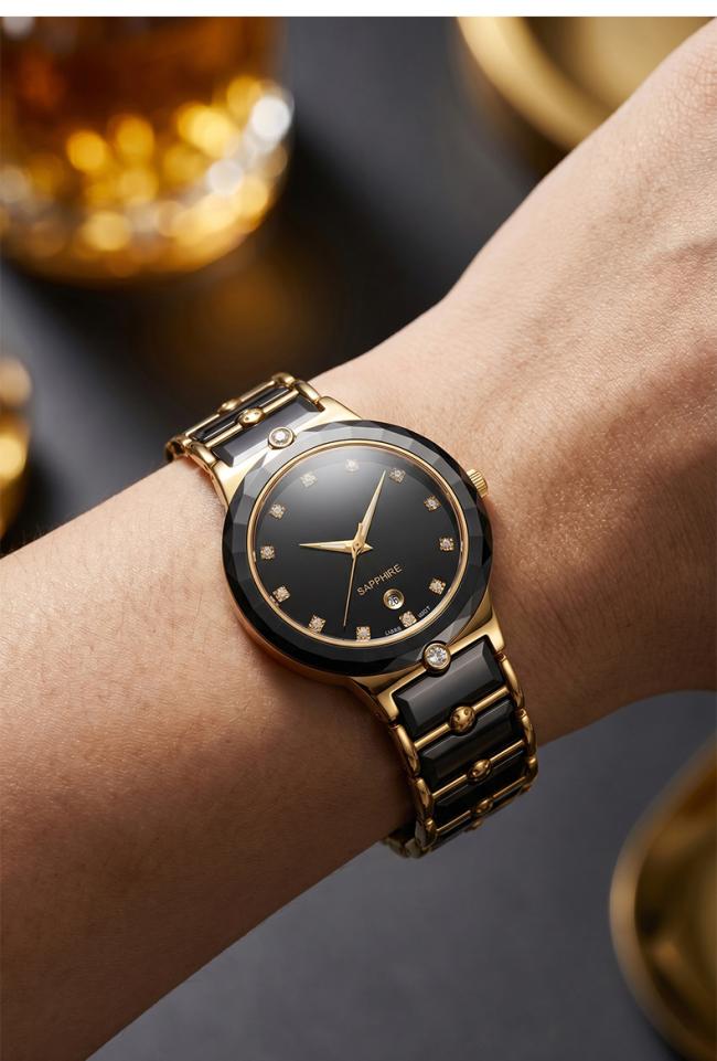 Close-up shot of black ceramic quartz watch with crystal indices and gold hands on wrist