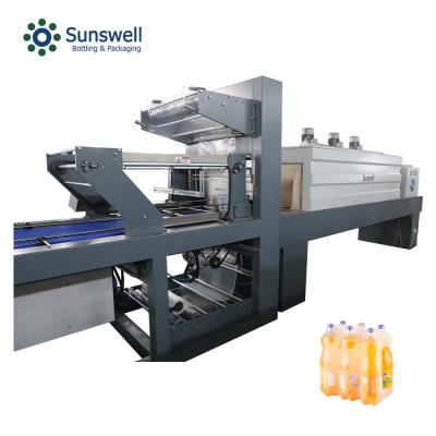 China Plastic Film Heat Shrinking Wrapping Packaging Machine With Shrink Tunnel for sale