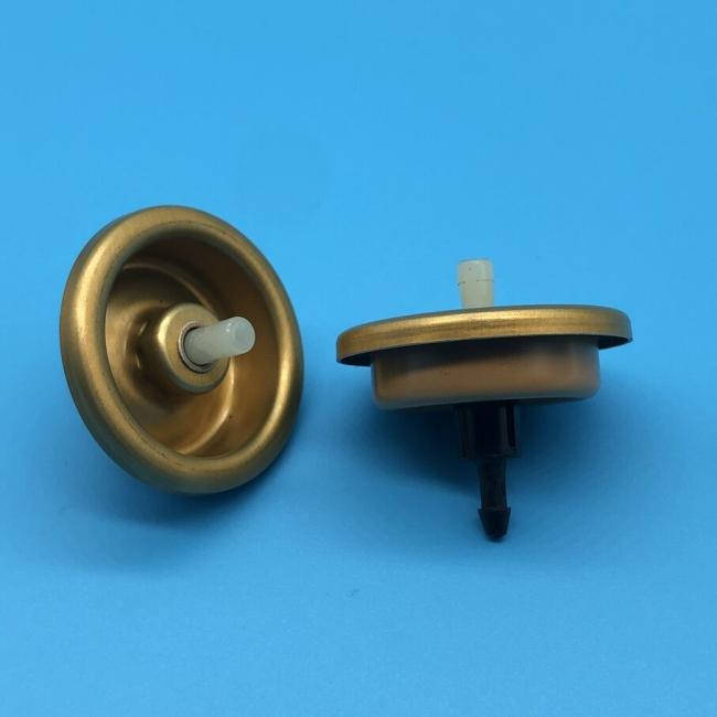 Close-up view of inverted hair mousse valve components