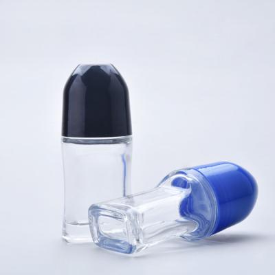 China 50ml Large Roller Ball Bottles Colored Balck Cap Glass Roll On Bottles for sale