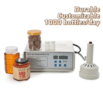 China Mini Manual Electromagnetic Induction Sealing Machine For Plastic Cups Can for sale