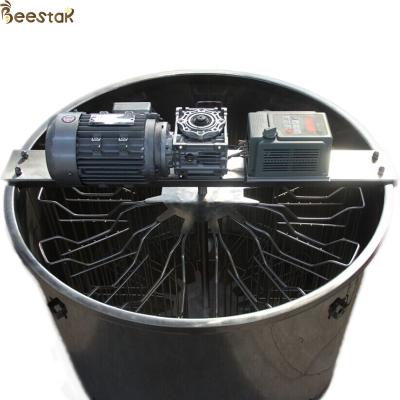 China Extractor de miel centrífugo radial automático de 12 marcos para procesamiento de miel de acero inoxidable en venta