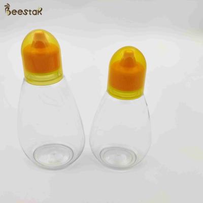 China 250ml 350ml 500ml Honey Jar And Spoon Plastic Empty Honey Bottles for honey storage for sale