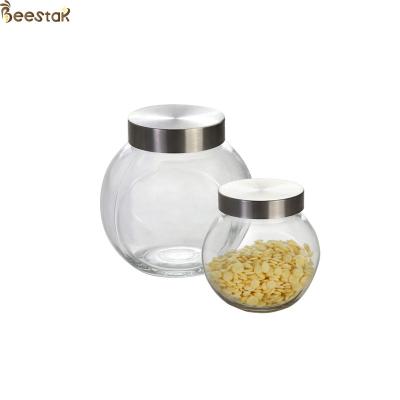 China 50ml Honey Jar And Spoon Flat Bottle With Metal Lid for sale